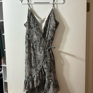 This has wrap dress has never been worn but the tags have been removed.
